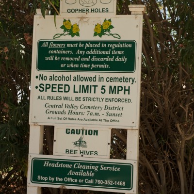 Sign: gopher holes and bee hives. Speed limit 5 MPH.
